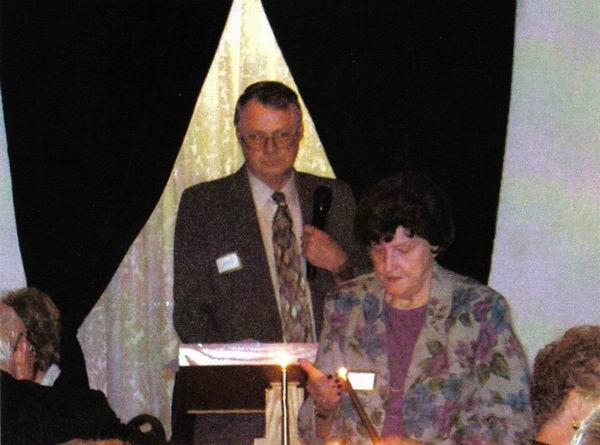 Phyllis Gorbet Bradley lighting candle at memorial service.