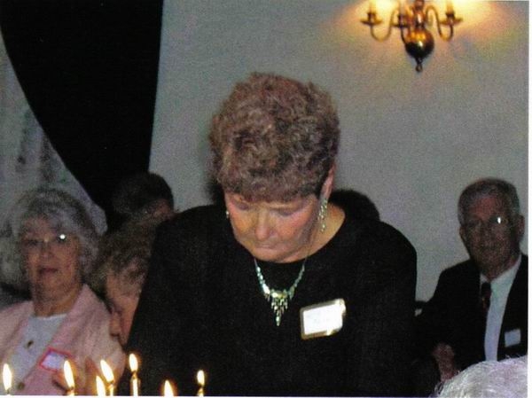 Alta Kuntz Hough lighting candle.