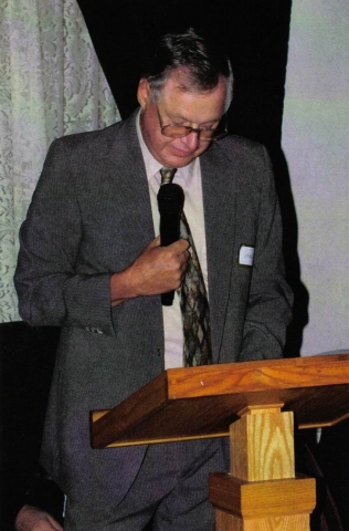 Gene Behler conducting memorial service.